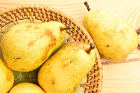 Ripe juicy, organic pears, close-up, on a wooden table.の写真素材