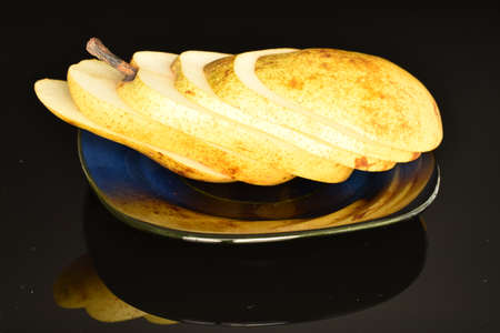 Ripe juicy, organic pears, close-up, on a black background.の写真素材