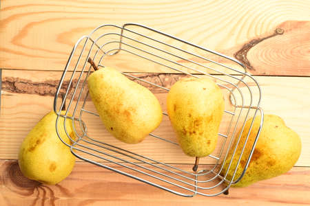 Ripe juicy, organic pears, close-up, on a wooden table.の写真素材