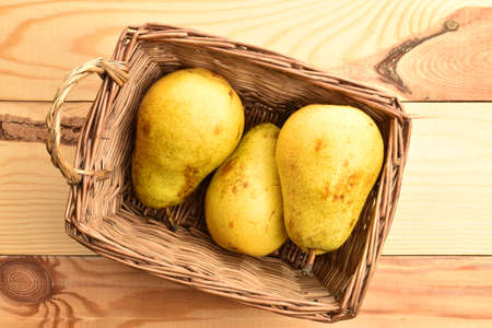 Ripe juicy, organic pears, close-up, on a wooden table.の写真素材