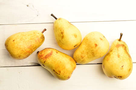 Ripe juicy, organic pears, close-up, on a wooden table.の写真素材