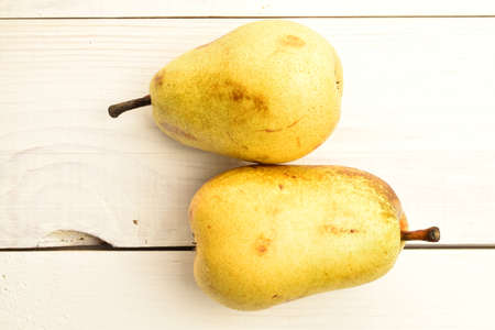 Ripe juicy, organic pears, close-up, on a wooden table.の写真素材