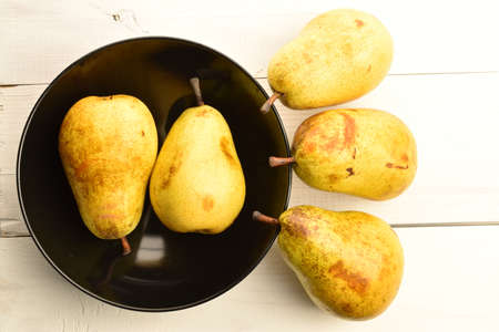 Ripe juicy, organic pears, close-up, on a wooden table.の写真素材