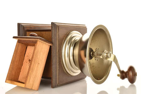Manual coffee grinder made of wood on a white background.の写真素材
