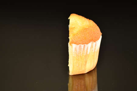 Fresh tasty muffins, close-up, on a black background.の写真素材