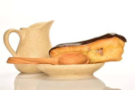 Sweet, mouth-watering chocolate eclairs, close-up, on a white background.の写真素材