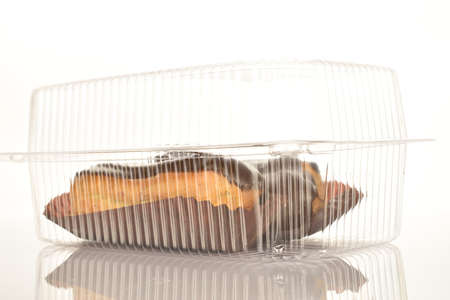 Sweet, mouth-watering chocolate eclairs, close-up, on a white background.の写真素材