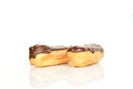 Sweet, mouth-watering chocolate eclairs, close-up, on a white background.の写真素材
