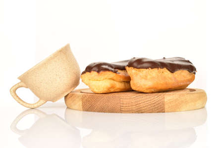 Sweet, mouth-watering chocolate eclairs, close-up, on a white background.の写真素材