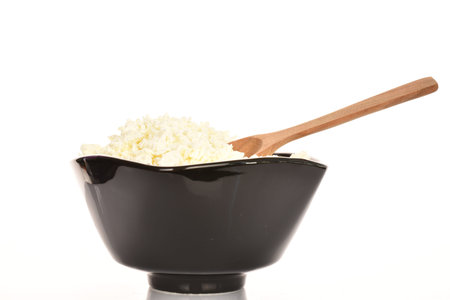 Fresh tasty, nutritious cottage cheese, close-up, on a white background.の写真素材