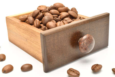 Fragrant roasted coffee grains, close-up, on a white backgroundの写真素材