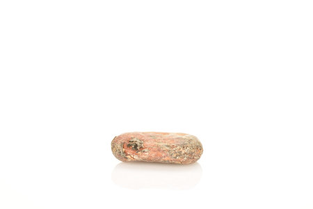Organic, natural cocoa beans, close-up, on a white background.