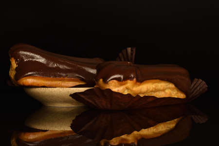 Chocolate eclair on a black backgroundの写真素材