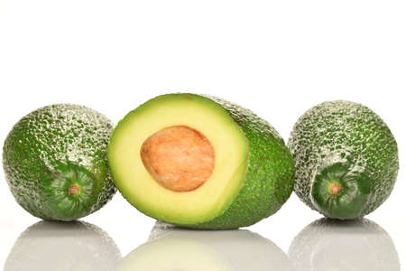 Juicy, ripe, organic avocados, close-up, on a white background.の写真素材
