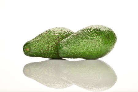 Juicy, ripe, organic avocados, close-up, on a white background.の写真素材
