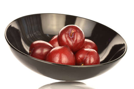 Juicy, tasty, organic red plum, close-up, on a white background.の写真素材
