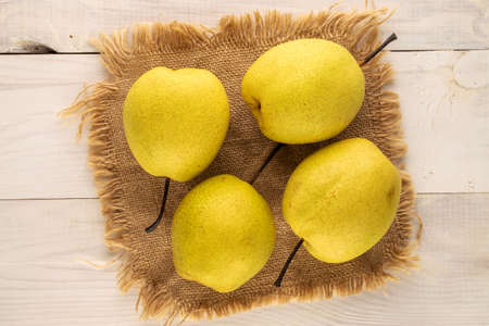 Organic bright yellow pears, close up.の写真素材