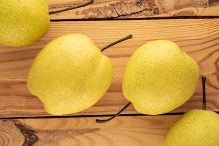 Organic bright yellow pears, close up.の写真素材