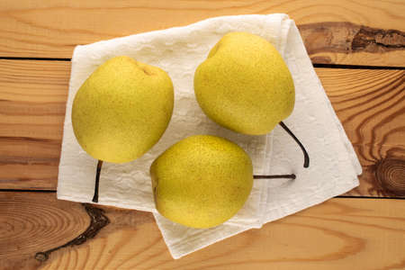 Organic bright yellow pears, close up.の写真素材