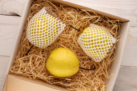 Organic bright yellow pears, close up.の写真素材