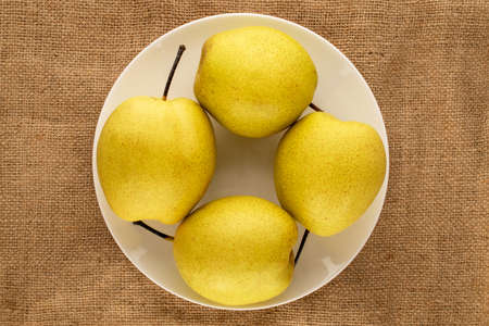 Organic bright yellow pears, close up.の写真素材