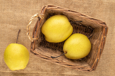 Organic bright yellow pears, close up.の写真素材