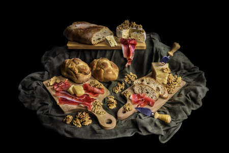 Italian starter with ham, cheese, wallnuts and breadの写真素材