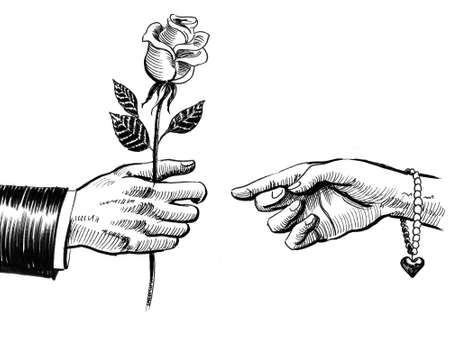 Men's hand giving rose flower to female handの写真素材