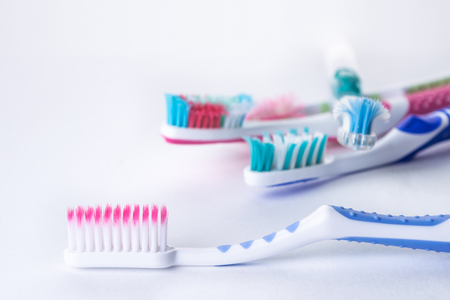New and old used toothbrushes isolated on a white backgroundの写真素材