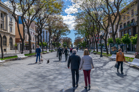 TARRAGONA, SPAIN - APRIL 4, 2019: People walking on  Rambla Novaのeditorial素材