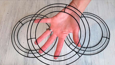 The hand holds a metal circle. isolated on white background. High resolution. Close.の写真素材