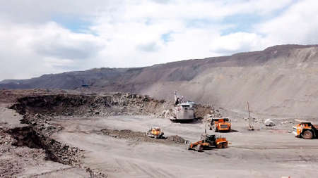 Canyon with equipment. Ore mining in the canyon. Huge ore mining technique.の写真素材