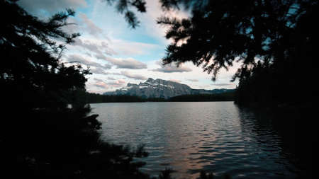 Canadian mountains. Filmed through the forest. Near the lake.の写真素材