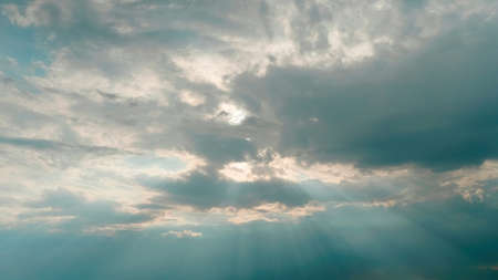Tuscany, Italy. The sun breaks through the clouds. The lights of a sun.の写真素材