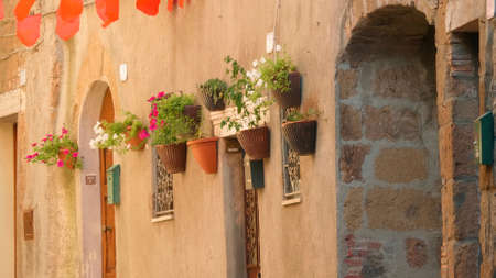 Tuscany, Italy. Flower pots on the wall.の写真素材
