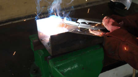 Welding an object, welding process with sparks and fumesの写真素材