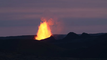 Volcanic eruption at dusk. Lava splash.etna eruption sicily lava natureの写真素材