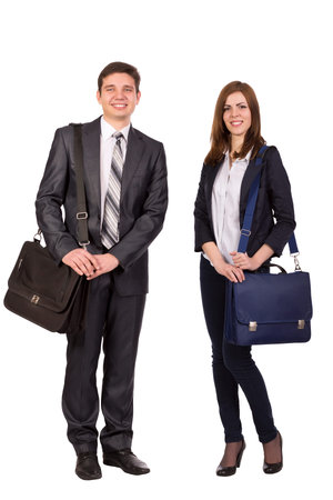 Nice young couple Young male and female students with bags officially dressed on white backgroundの写真素材