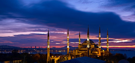 Sultan Ahmed Mosque at sunrise Blue Mosque most famous Ottoman Cathedral in Istanbul city illuminated with night spotlight and amazing sunrise sky on backgroundの写真素材