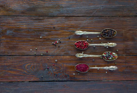 Selection of Aromatic Seasonings on Rough Dark Natural Wooden Board Tableの写真素材