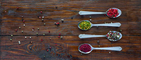Selection of Aromatic Seasonings on Rough Dark Natural Wooden Board Tableの写真素材