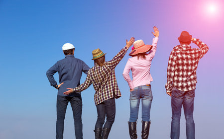 Four People Men and Women Together on Blue Sky Background Casual Jeans Style Dress Hands Gesturing...
