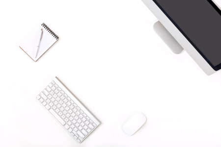 Modern trendy Working Place of Designer with large Computer Monitor Keyboard Notepad Pen and Mouse on White Desk black Screenの写真素材
