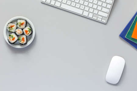 Top View of Office Work Place on grey Desk with Sushiの写真素材