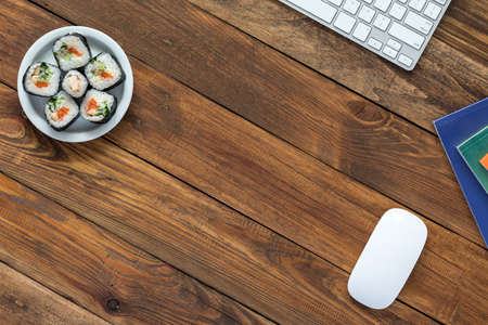 Top View of Vintage wooden Table with Computer and Foodの写真素材