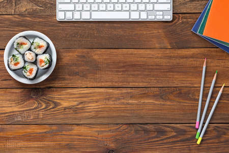 Top View of Vintage wooden Table with Computer and Foodの写真素材