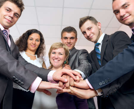 Happy Business Team uniting Hands and smilingの写真素材