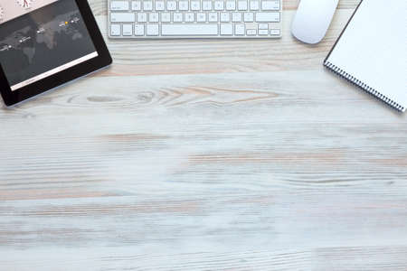 Composition with modern Electronics and Stationery Items in Wood Backgroundの写真素材