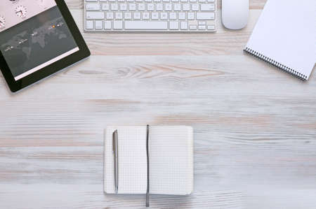 Composition with modern Electronics and Stationery Items in Wood Backgroundの写真素材