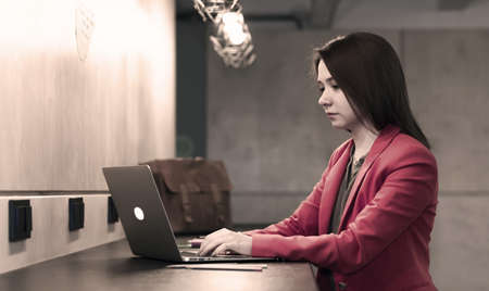 Young Woman working at wooden Bar Counterの写真素材